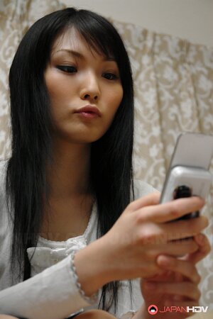 Horny Japanese lady Ruri Shinohara enjoys toying her hairy muff on webcam