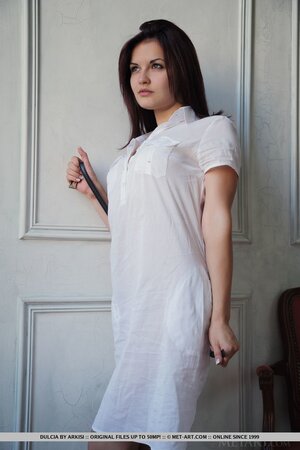 Gorgeous brunette Dulcia enjoys stripping and showing off her stretched pussy