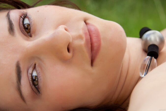 Katy C shows off her fantastic tits outdoors while naked