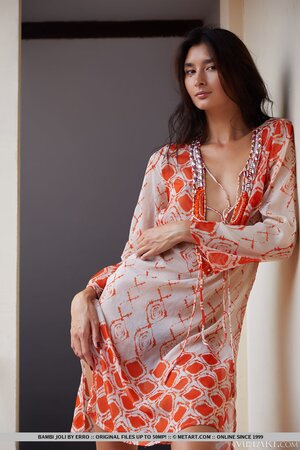 Solo model Bambi Joli enjoys posing naked after stripping