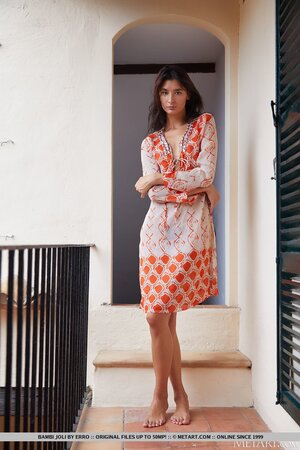 Solo model Bambi Joli enjoys posing naked after stripping