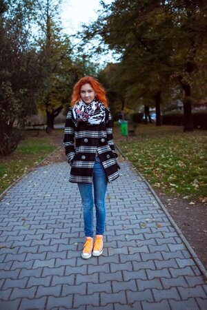 Redheaded babe Ambre removes her clothes and poses nude