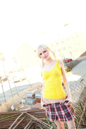 Lacey Lust strips and fingers her pussy for a hardcore photo shoot