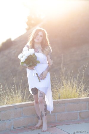 Bride with amazing curves and lots of ink slowly gets naked