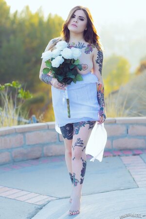 Bride with amazing curves and lots of ink slowly gets naked