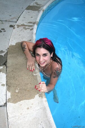 Punk chick Joanna Angel gets naked by the pool with pink hair and a perfectly shaped body