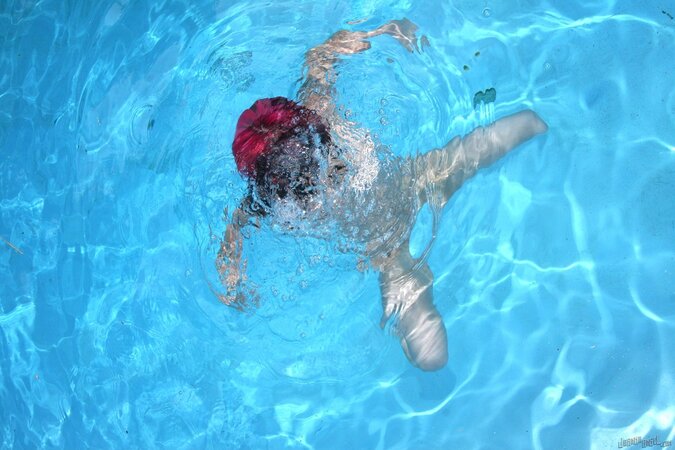 Punk chick Joanna Angel gets naked by the pool with pink hair and a perfectly shaped body