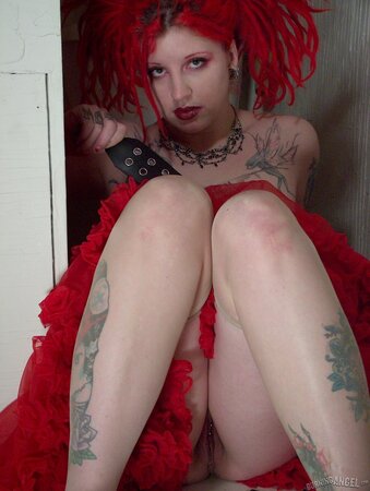 Fetish chick with flaming red hair spreads her chubby pussy wide in the bathroom