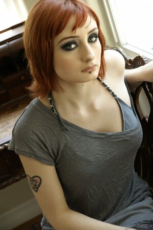 Violet Monroe sucks and toys her blue dildo in the window