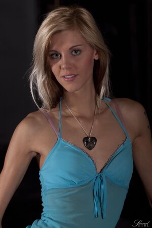 Sindy Vega peels to show her flat chest and tiny ass