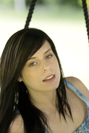 Daniella Rose enjoys her free time in the swing while stripping