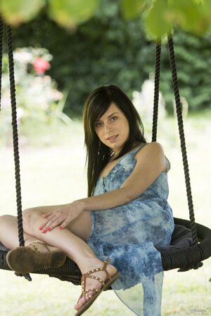 Daniella Rose enjoys her free time in the swing while stripping