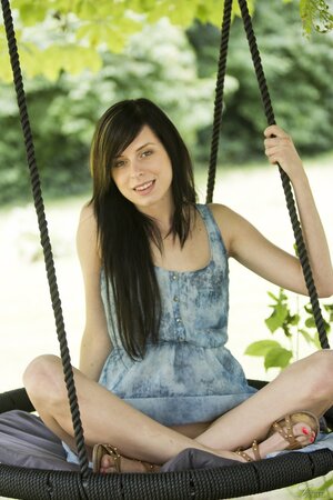 Daniella Rose enjoys her free time in the swing while stripping