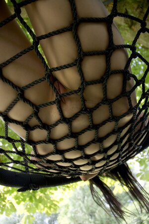 Daniella Rose enjoys her free time in the swing while stripping