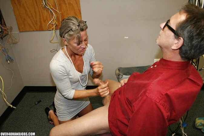 Naughty mature lady Leilani Li enjoys sensually jerking off a big cock