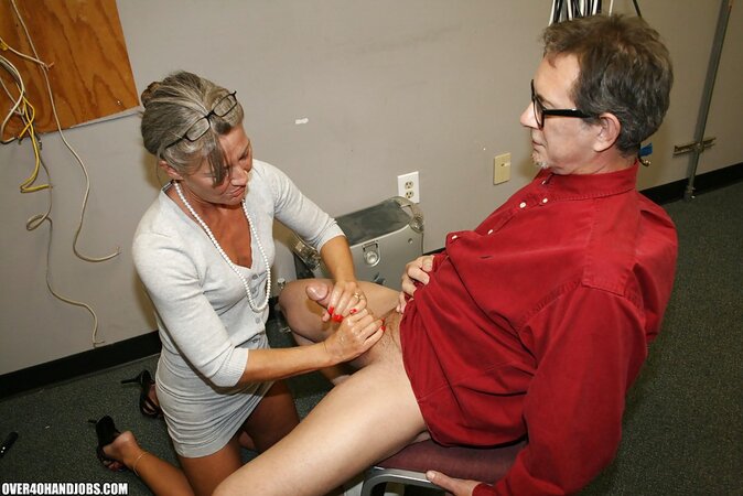 Naughty mature lady Leilani Li enjoys sensually jerking off a big cock