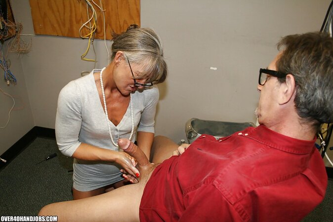 Naughty mature lady Leilani Li enjoys sensually jerking off a big cock