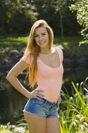 Alexis Crystal strips naked and poses seductively outdoors