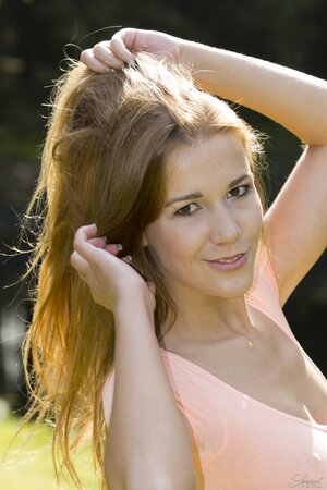 Alexis Crystal strips naked and poses seductively outdoors