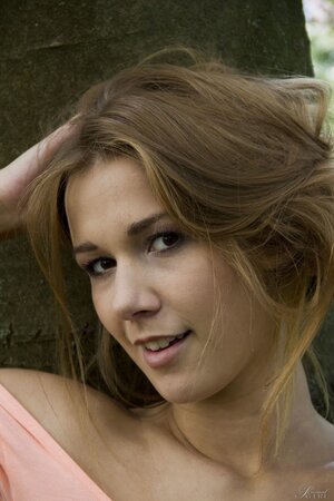 Alexis Crystal strips naked and poses seductively outdoors