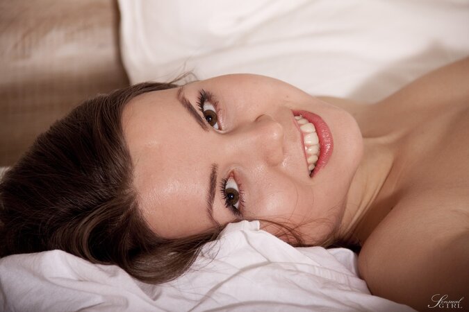 Lovely teen babe Jalace enjoys posing naked on the bed while fondling her tits and fingering herself