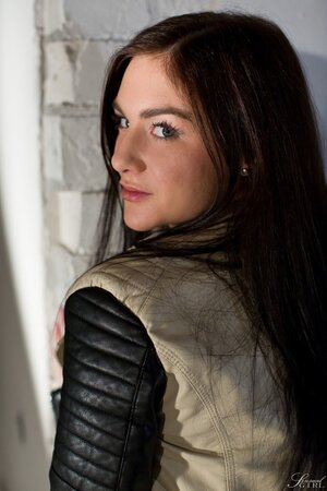 German stunner Lullu Gun strips down to her knee-high socks on a throw rug