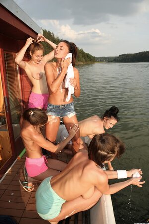 Ana Bell Evans and Antonia Sainz indulge in toy play with their friends on a boat on the river