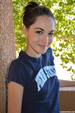 Emily G enjoys pulling her shorts down over her ass on the condo balcony