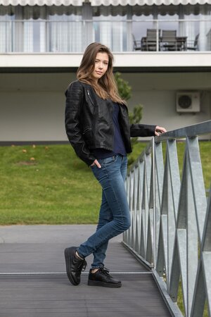 Beautiful chick is masturbating and sunbathing on top of the roof