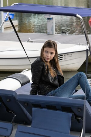 Beautiful chick is masturbating and sunbathing on top of the roof