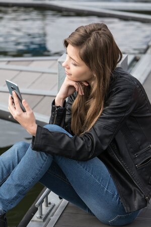 Beautiful chick is masturbating and sunbathing on top of the roof