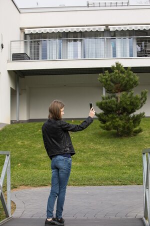 Beautiful chick is masturbating and sunbathing on top of the roof