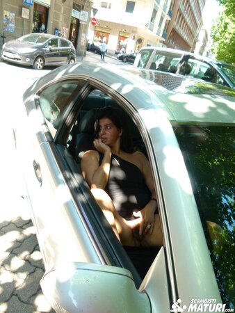 Gianna Michaels enjoys a car ride after getting a mouthful of cum with Sandra M