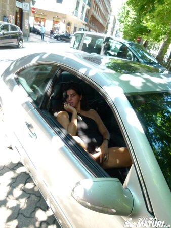 Gianna Michaels enjoys a car ride after getting a mouthful of cum with Sandra M