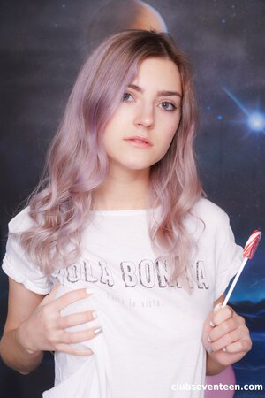 Eva Elfie enjoys stripping to her socks and toying her bald pussy