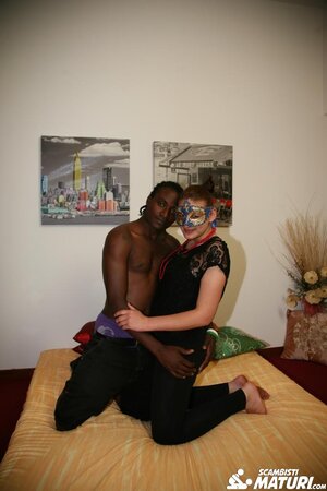 Chubby mature Giovanna in a mask enjoys giving a BBC blowjob and getting it doggystyle