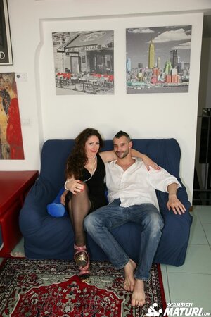 Italian mature woman Eva Ferrari enjoys getting fucked on the blue armchair with PD Alex