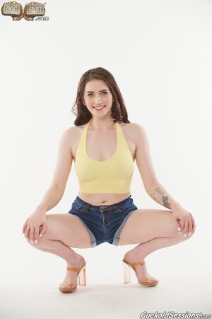 Aria Carson enjoys a big black cock while a cuckold watches