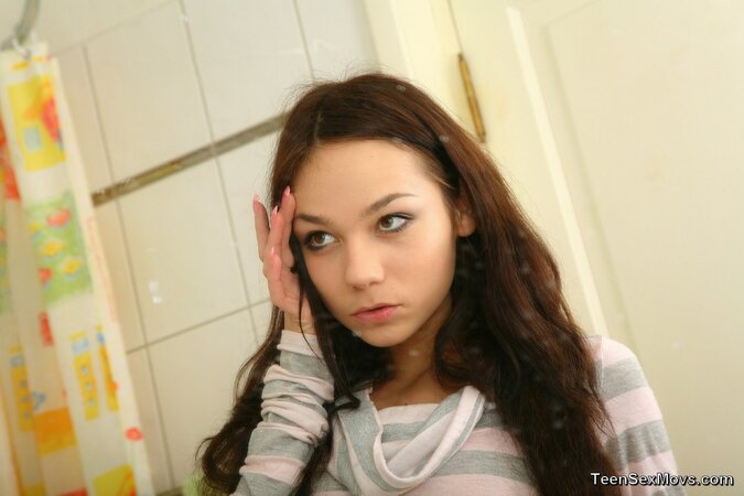 Slender teen with long hair gets wild with her boyfriend in the shower