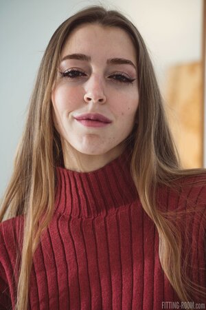 Mary Popiense enjoys stripping down to her sweater