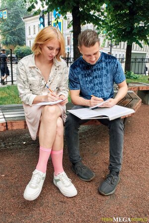 Emma Korti exposes her cute ass and takes a boner on a bed