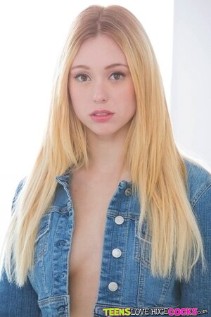 Lucy Tyler demonstrates her shaved pussy and tight ass