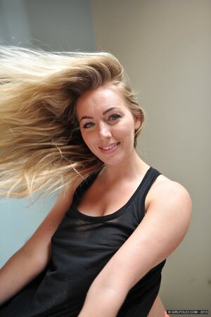 Hayley Coppin shows off her perfect big tits and poses naked by the window