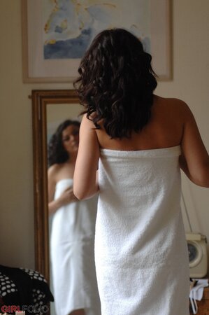 Sexy brunette Bryoni Kate gets naked by a window while trying on new panties