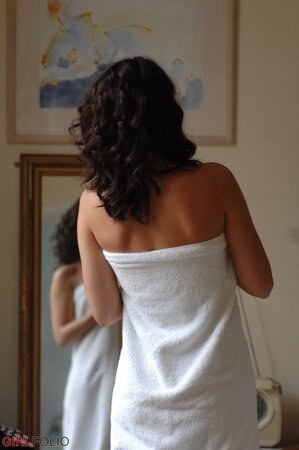 Sexy brunette Bryoni Kate gets naked by a window while trying on new panties