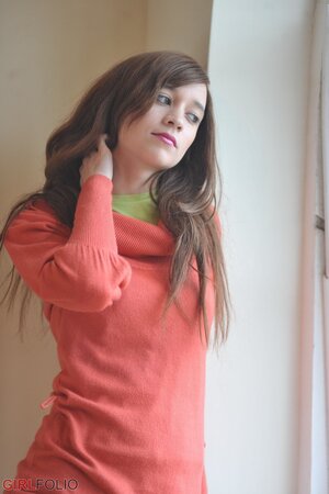 Simone takes off her blue jeans in a non-nude action