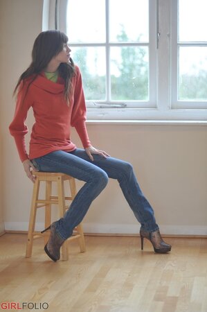 Simone takes off her blue jeans in a non-nude action