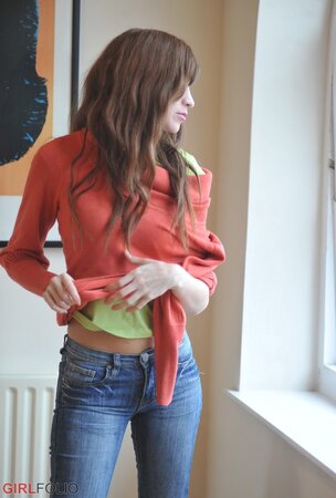 Simone takes off her blue jeans in a non-nude action