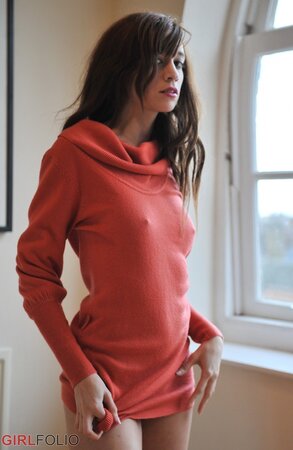 Simone takes off her blue jeans in a non-nude action