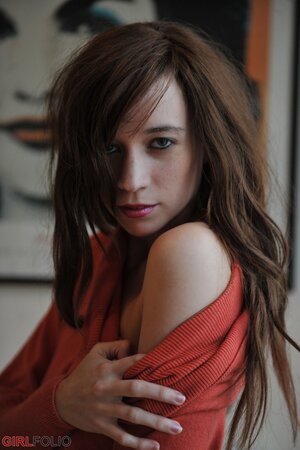 Simone takes off her blue jeans in a non-nude action